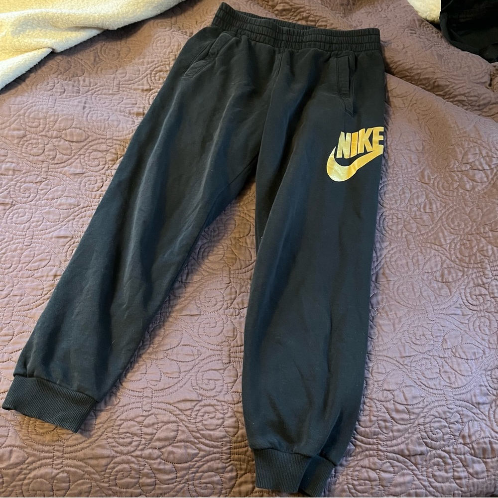 Nike Black Sweatpants with Metallic Gold Logo Accent